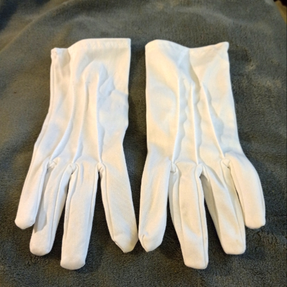 A pair of white gloves